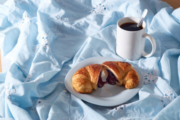 Plate of fresh croissants with chocolate stuffing