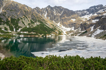 Great spring landscape in the Black Pond Gasienicowy. High Tatras.