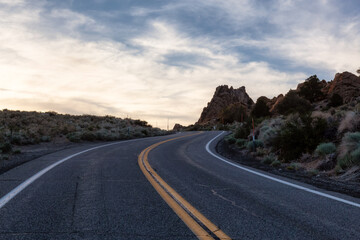 Scenic highway in the mountain landscape. Sunset Sky. State Route 120, California, United States of America. Adventure Travel