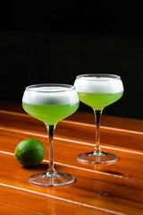 Green cocktail with vermouth, mint and citrus