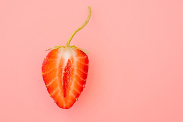 Close-up of strawberry slice with form as female vagina, creativity concept picture