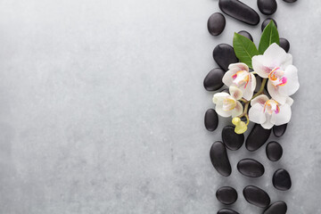Spa stone, orchid theme objects on grey background.