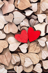 Wooden hearts, one red heart on the heart background. - 514249034