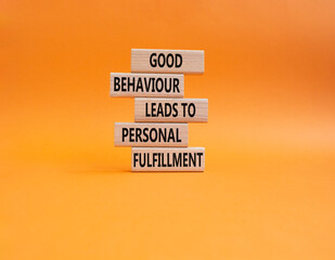 Good behaviour leads to personal fulfillment symbol. Concept words Good behaviour leads to personal fulfillment on wooden blocks. Beautiful orange background. Business concept. Copy space.