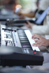 Obraz premium Human hand on the piano keyboard