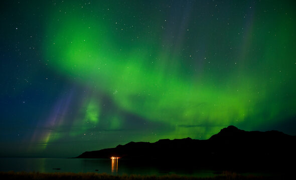 Northern lights over a fjord in the remote east of Iceland