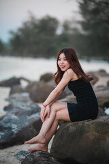 Cambodian woman at sea in the evening in Sihanoukville, Cambodia