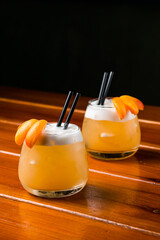 tangerine cocktail with white foam