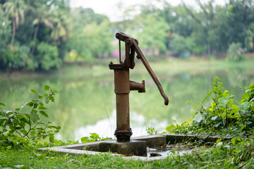 Hand-operated water pump, rusted and forgotten
