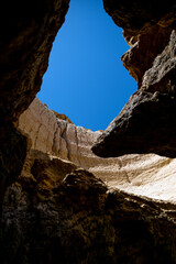 sky through hole in rocky cave