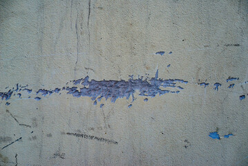 The concrete texture, wall, with cracks and scratches can be used as a background