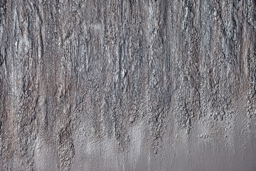 Close-up macro image of textured bright wall background on full frame
