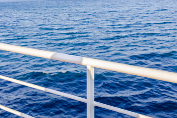 railing on a ferry boat of the ferry to Elba leaving the port of Piombino on the Blue Sea