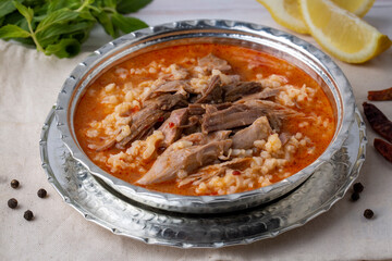 Turkish Soup Beyran with Lamb Meat, Rice, Chopped Garlic and Vinegar Sauce. Traditional Organic Food. Traditional soup of Gaziantep, Turkey. (Turkish name; Beyran corbasi)