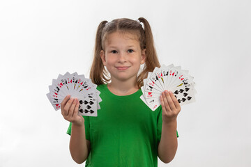Close up portrait of caucasian girl with playing cards. Isolated on white background. Childhood...