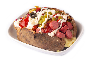 Kumpir, Turkish baked potato with cheese, corn, sausage, ketchup, mayonnaise and olives. This kumpir is traditional turkish food