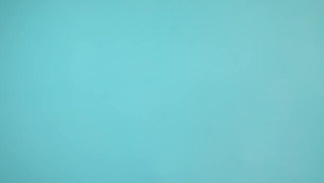 Light blue background. The texture is blue. Slow motion background
