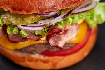 tasty burger with beef cutlet and vegetables
