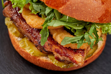 tasty burger with beef cutlet and vegetables