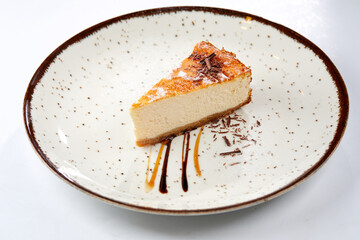 tasty cheesecake with chocolate sauce