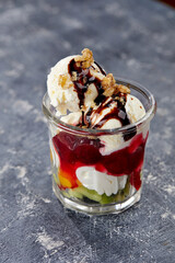 ice cream with fresh fruits and syrup