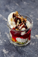 ice cream with fresh fruits and syrup