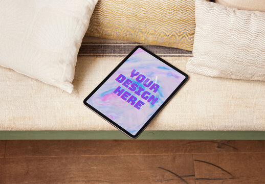 Mockup of a Tablet on a Couch at Home