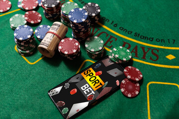inscription your bet wins on a smartphone on the poker table.