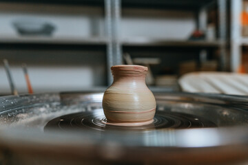 Vase on potter's wheel at workshop indoor