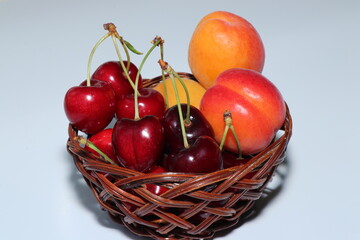 Juicy and delicious apricots, cherries and currants isolated on a white background. Berries and fruits