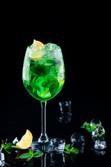 Refreshing summer alcoholic cocktail mojito with ice, fresh mint and lime