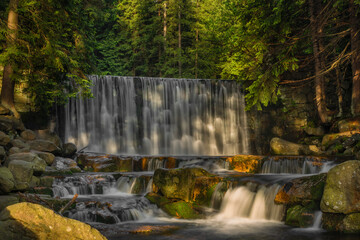 Fototapeta Dziki waterfall in Karpacz town in Krkonose mountains in spring fresh morning obraz
