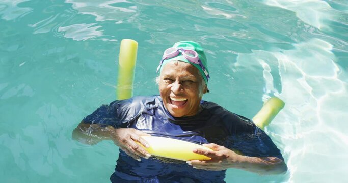 Video Of Happy Senior African American Women Swimming In Pool