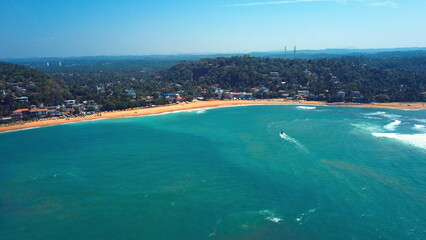 Fototapeta premium Beach coastline in Unawatuna, Sri Lanka. Popular destination for tourists visiting Sri Lanka. Situated close to Galle and Mirissa