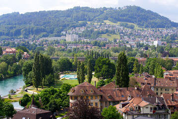 Aerial view over City of Bern, capital of Switzerland, with outdoor swimming pool named Marzili on a sunny summer day. Photo taken June 16th, 2022, Bern, Switzerland.