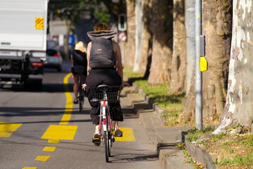 Cyclists on bicycle lane at City of Bern on a sunny summer morning. Photo taken June 16th, 2022, Bern, Switzerland.