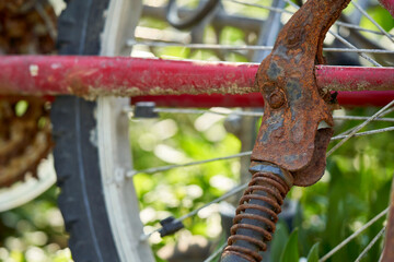 Close up of an old rusty bicycle. Stand on red frame. MTB Two-wheeler is a sea find (Seefunde).