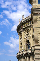 Fototapeta na wymiar Facade of Federal Palace of Switzerland (German Bundeshaus) at City of Bern, capital of Switzerland, on a blue cloudy summer day. Photo taken June 16th, 2022, Bern, Switzerland.