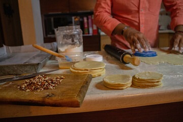 person kneading dough