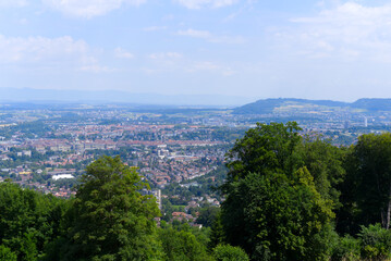 Aerial view over City of Bern and Canton Bern seen from local mountain Gurten on a blue cloudy summer day. Photo taken June 16th, 2022, Gurten, Switzerland.