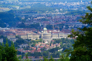 Aerial view over City of Bern and Canton Bern seen from local mountain Gurten on a blue cloudy summer day. Photo taken June 16th, 2022, Gurten, Switzerland.