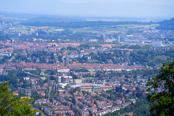 Aerial view over City of Bern and Canton Bern seen from local mountain Gurten on a blue cloudy summer day. Photo taken June 16th, 2022, Gurten, Switzerland.