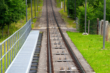 Fototapeta premium Railway track of Gurten cable car with cable wheels on a sunny sumner day Photo taken June 16th, 2022, Gurten, Switzerland.