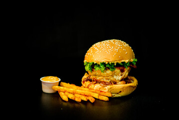 Burger with mayonnaise and french fries