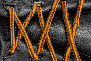 Shoe lacing close up. Shoelaces crossing. Orange Shoelaces. - obrazy, fototapety, plakaty