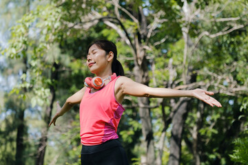 Asian woman doing exercise in park.