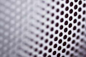 close up of audio speaker grill pattern background
