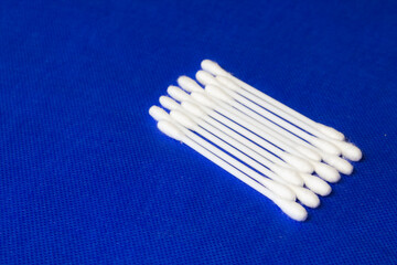 cotton buds on a colored background. 100% bavovna, used both in medicine and in cosmetology