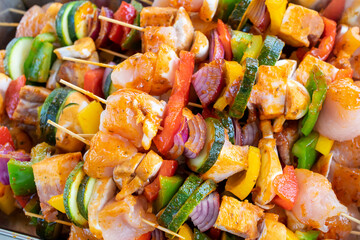 meat and vegetable skewers ready for grilling