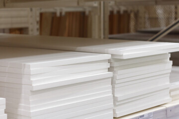 Two stacks of white furniture shelf, selective focus.